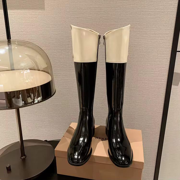 High-shine black leather boots