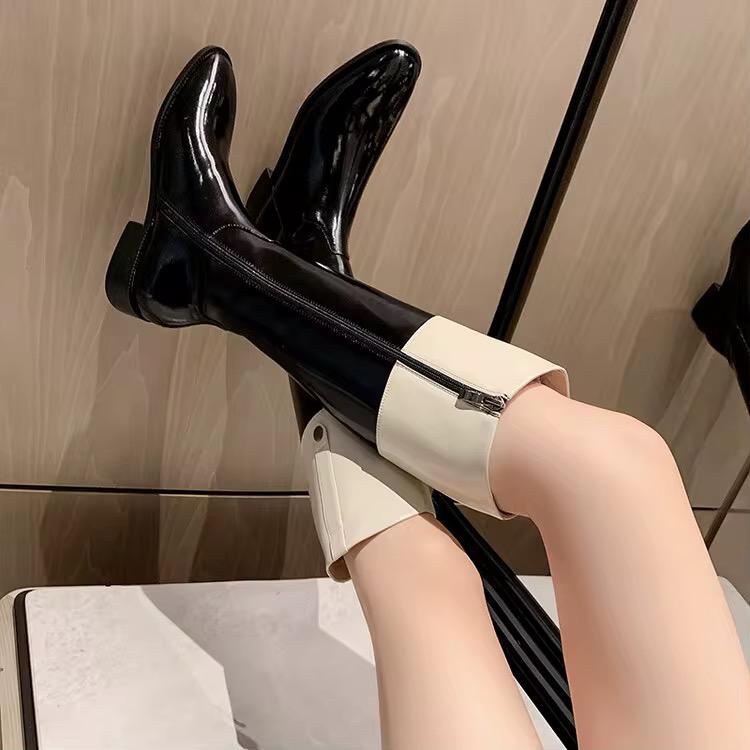 High-shine black leather boots