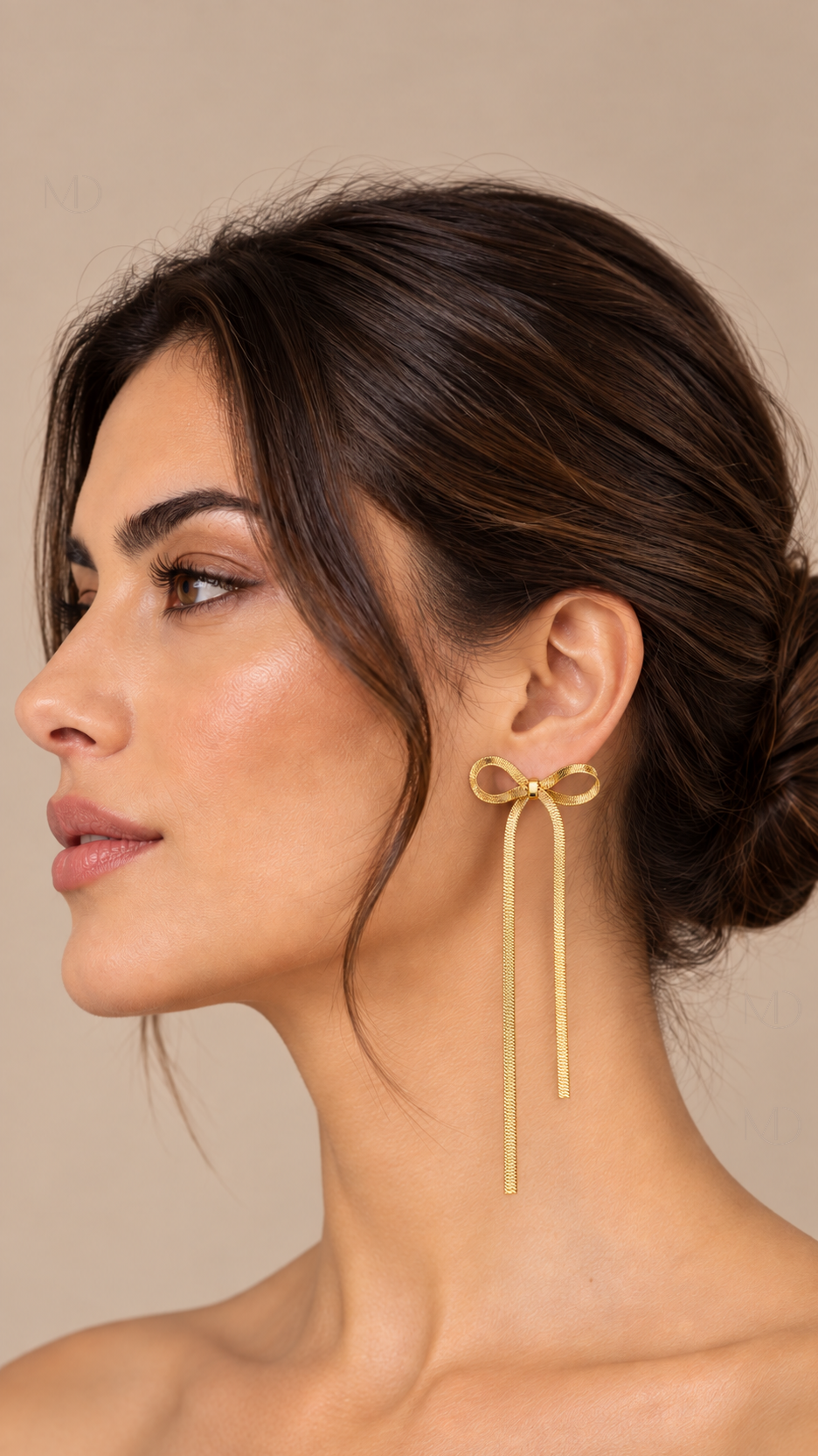 Belle Metal Bow Earrings — gold tassel model closeup