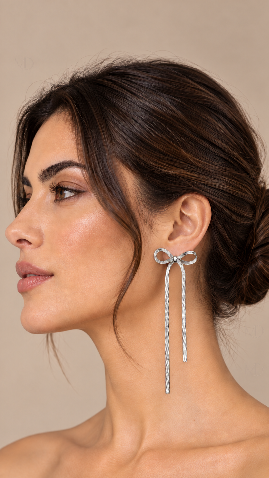 Belle Metal Bow Earrings — silver tassel model closeup