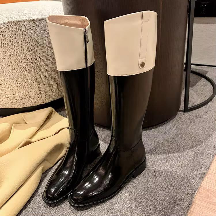 High-shine black leather boots
