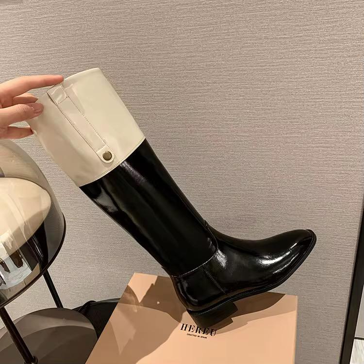 High-shine black leather boots