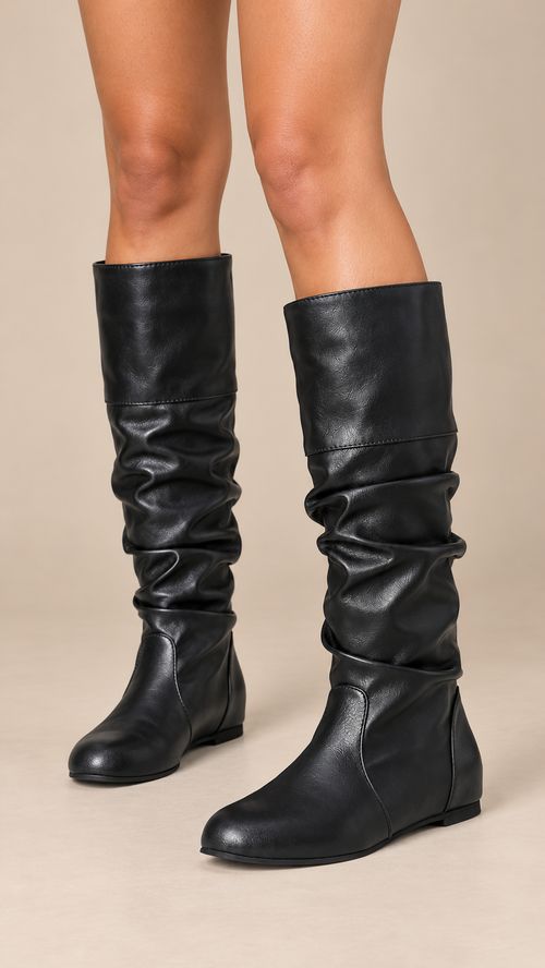 Thessaly Slouch Boot — Black worn closeup