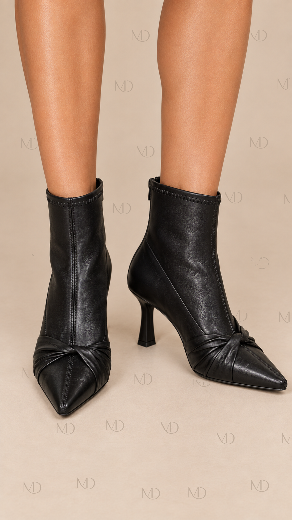 Sienna Knotted Stiletto Boots — Black worn closeup