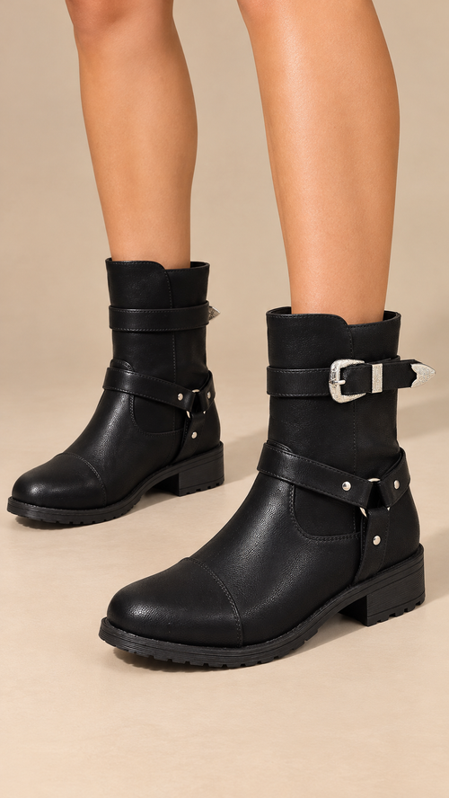 Valeska Buckle-Strap Boot — Black worn closeup