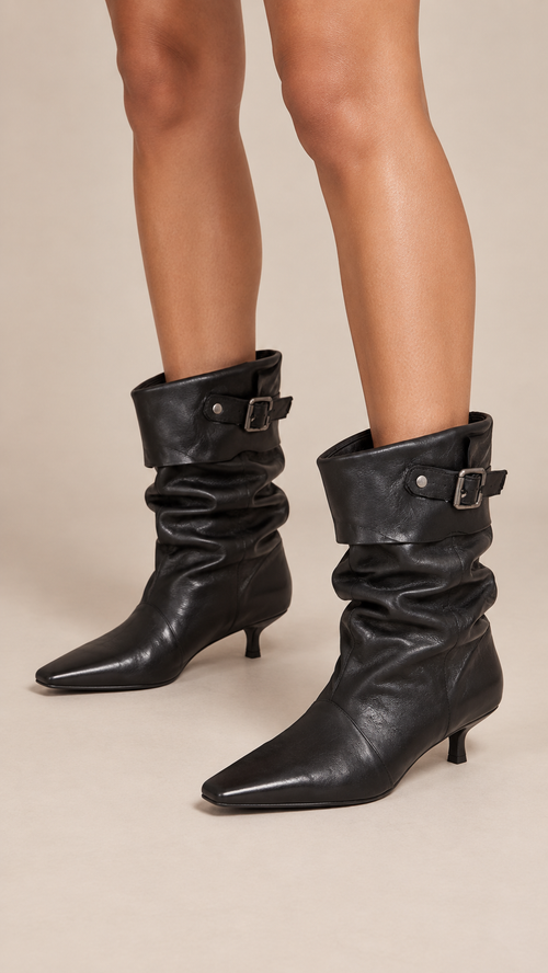 Delphine Slouch Boots — Black worn closeup