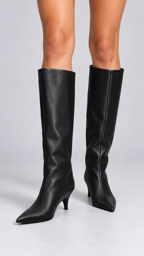 Maribeth Stiletto-Point Knee Boot — Black worn closeup
