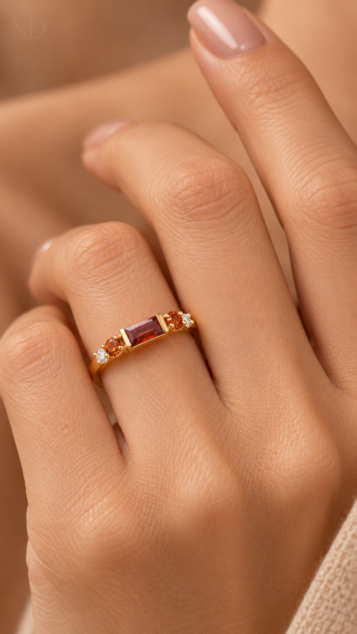Cintra gold baguette ring worn on hand