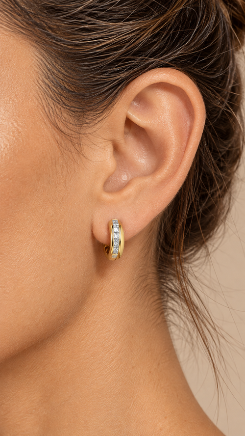 Valetta Channel-Set Huggie — Gold worn closeup