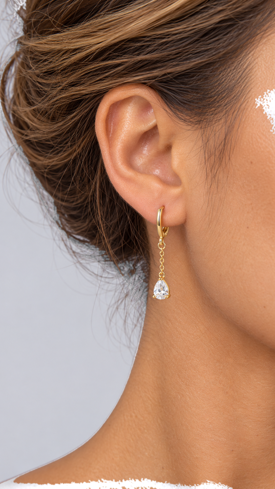 Ysaura Teardrop Huggie Drops — Gold worn closeup