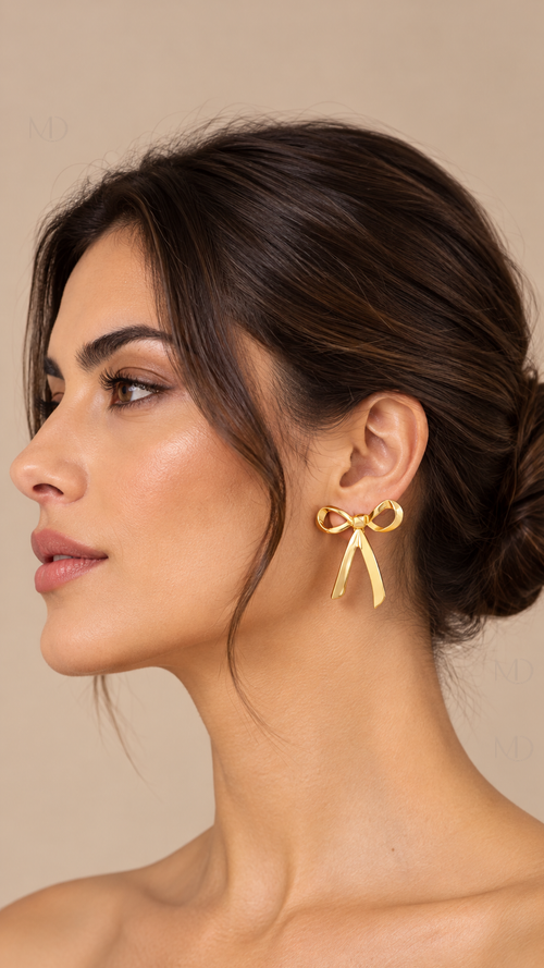 Belle Metal Bow Earrings — gold model closeup