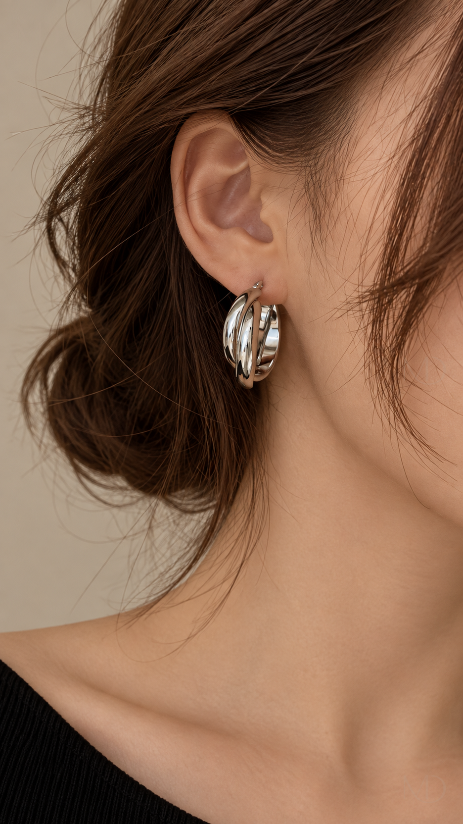 Torsade Twisted Hoop Earrings - Silver worn model close-up